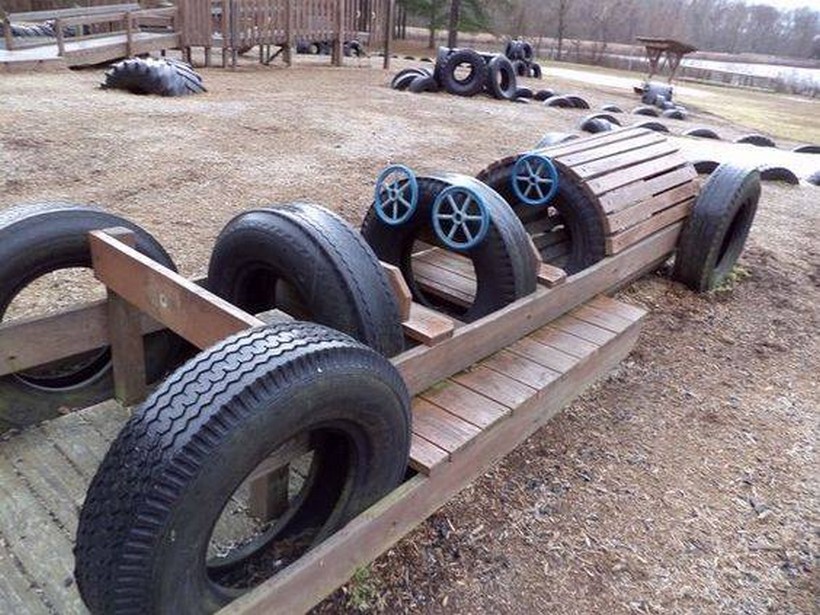 kids vehicle with used tires and pallets