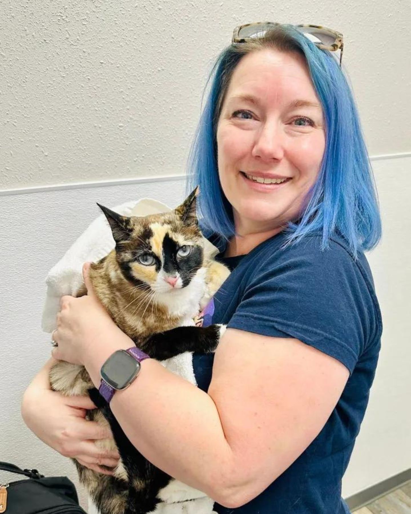 woman holding a cat